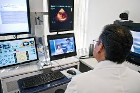 Doctor at multiscreen workstation
