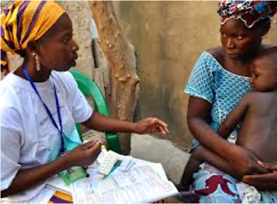 Health worker with mother and child